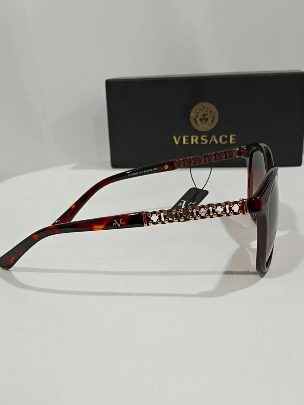 Versace Women's Black and Tortoiseshell Sunglasses with Dark Lenses